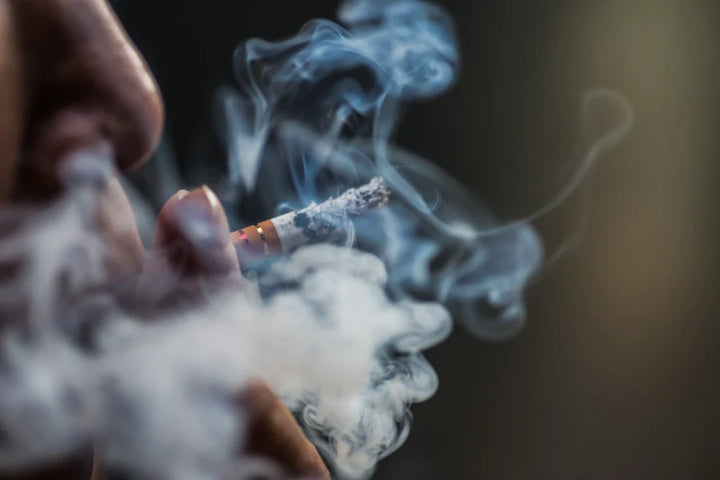 man smoking | The Truth About Why does smoking cause hair loss? | can smoking leads to hair loss
