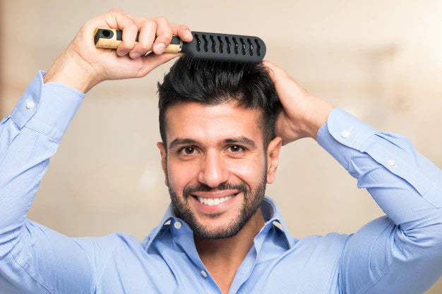 How to be a modern man: Things every modern man should know | man combing his hair