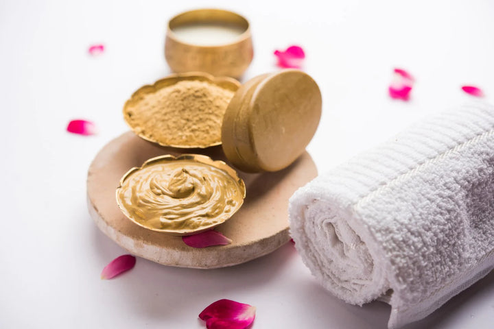Bowl of multani mitti powder, paste and towel | multani mitti benefits for hair