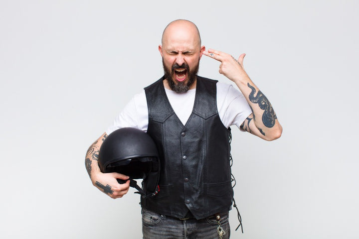 Ways to prevent hair loss from helmets | man carrying helmet | bald man