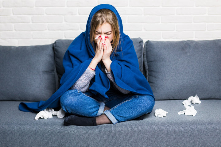 a woman sneezing