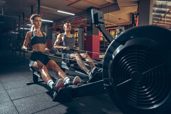 a man and a woman working out in the gym