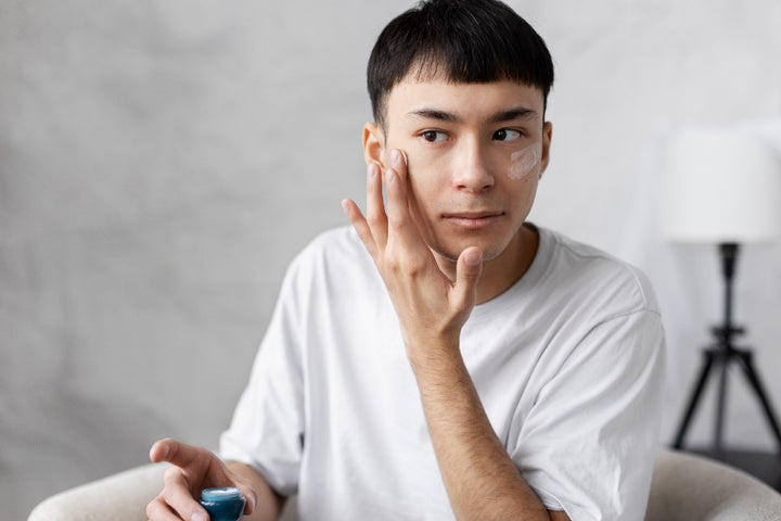 a man applying cream on his face