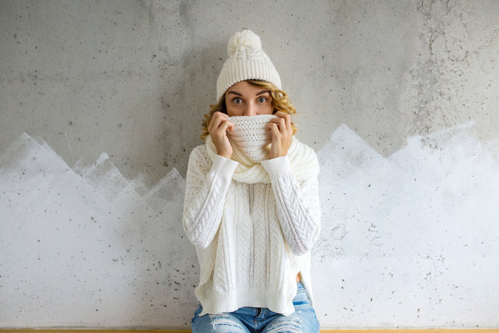 a woman with a hoodie and winter cap