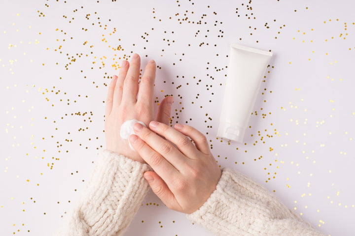 a woman applying winter cream on her hand