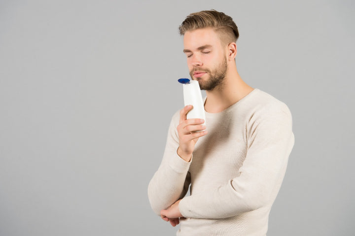 a man using a dry shampoo